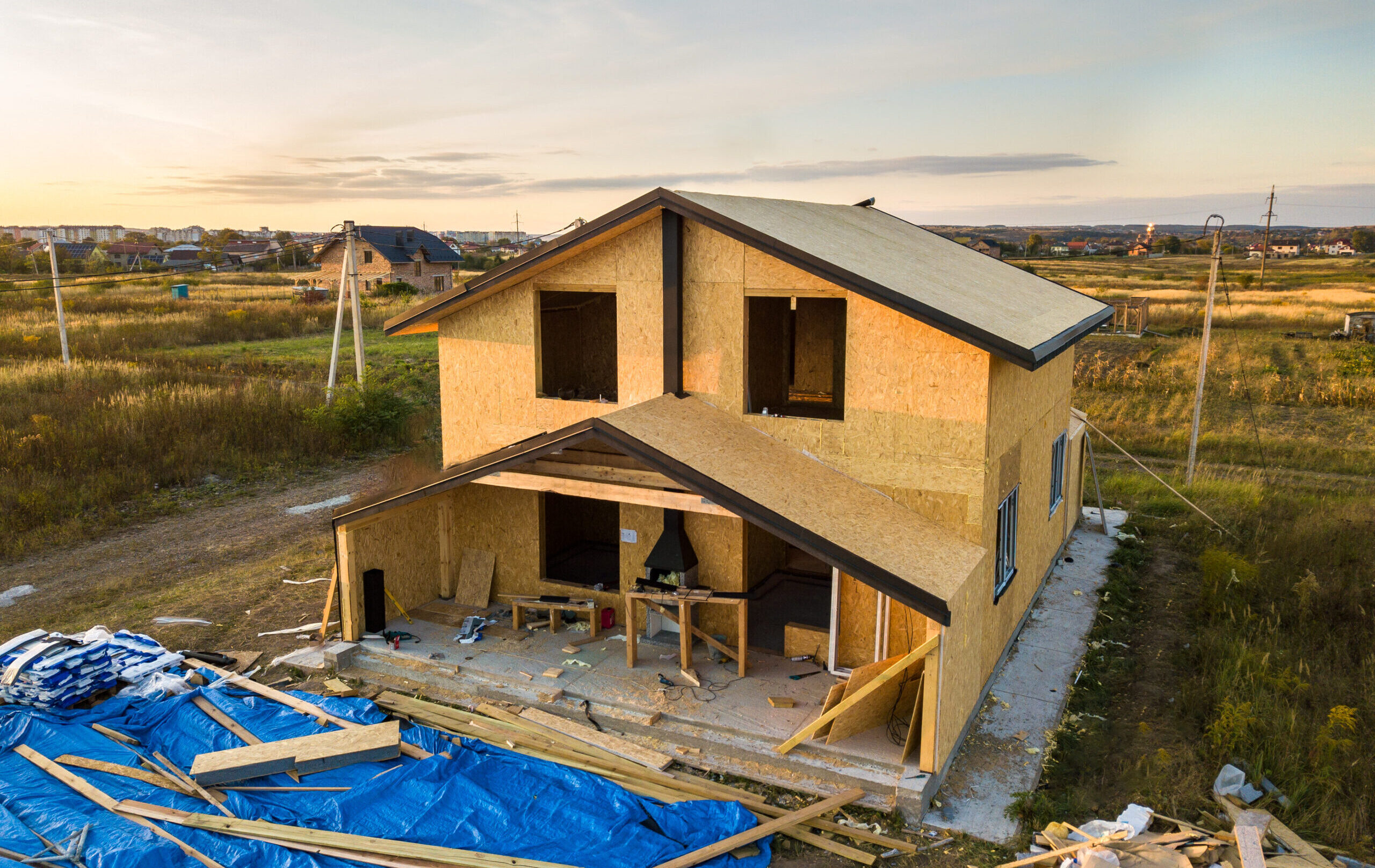 Construction of new and modern modular house. Walls made from composite wooden sip panels with styrofoam insulation inside. Building new frame of energy efficient home concept.